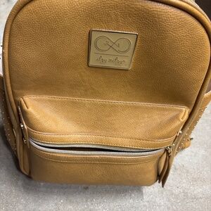 Itzy ritzy tan backpack